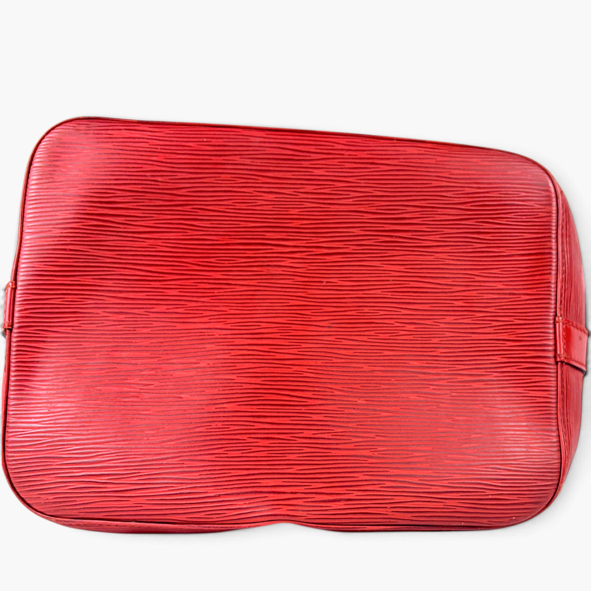 Red textured leather bucket bag, rounded top with side zipper tab details