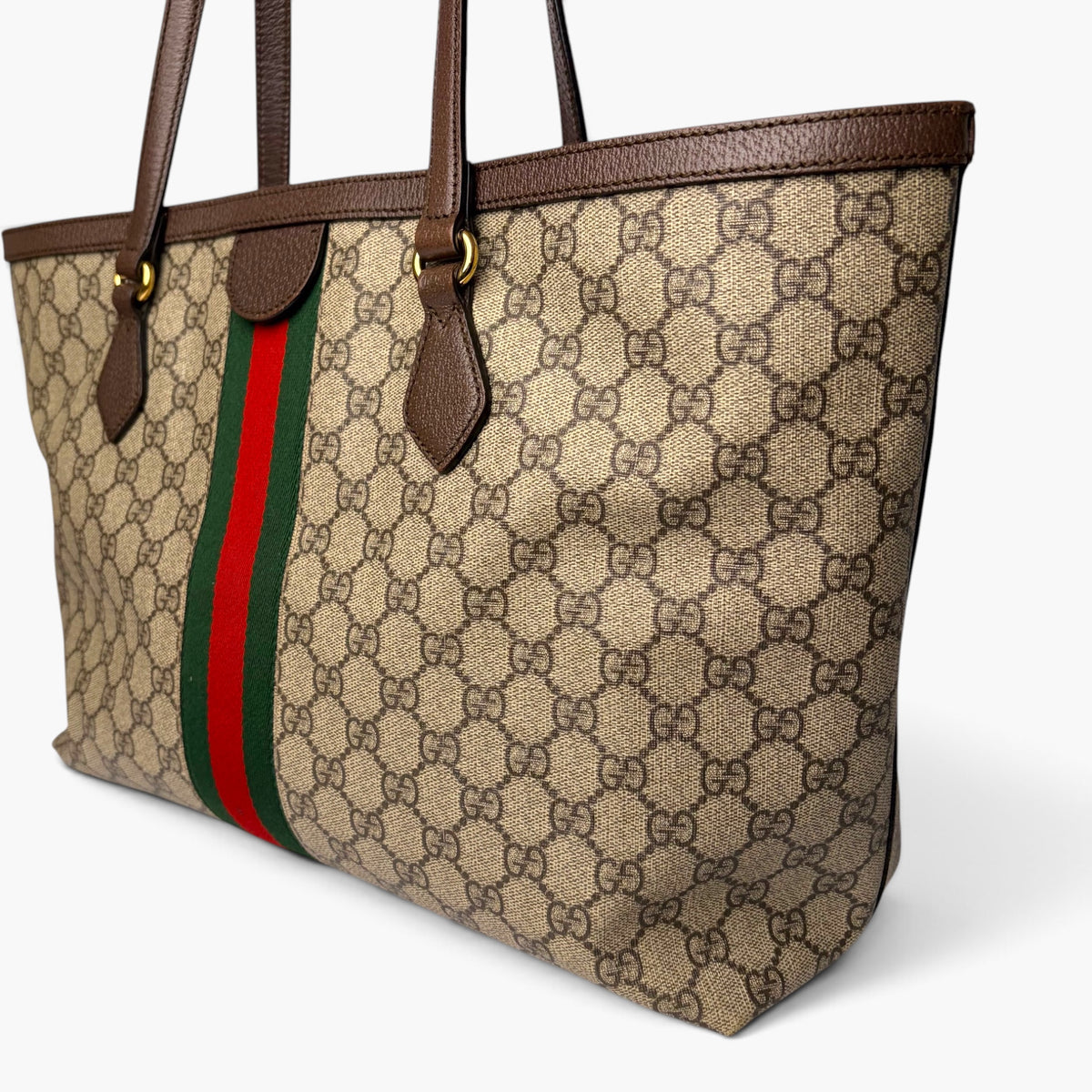 Medium GG monogram tote with brown leather handles, web stripe panel, and flap