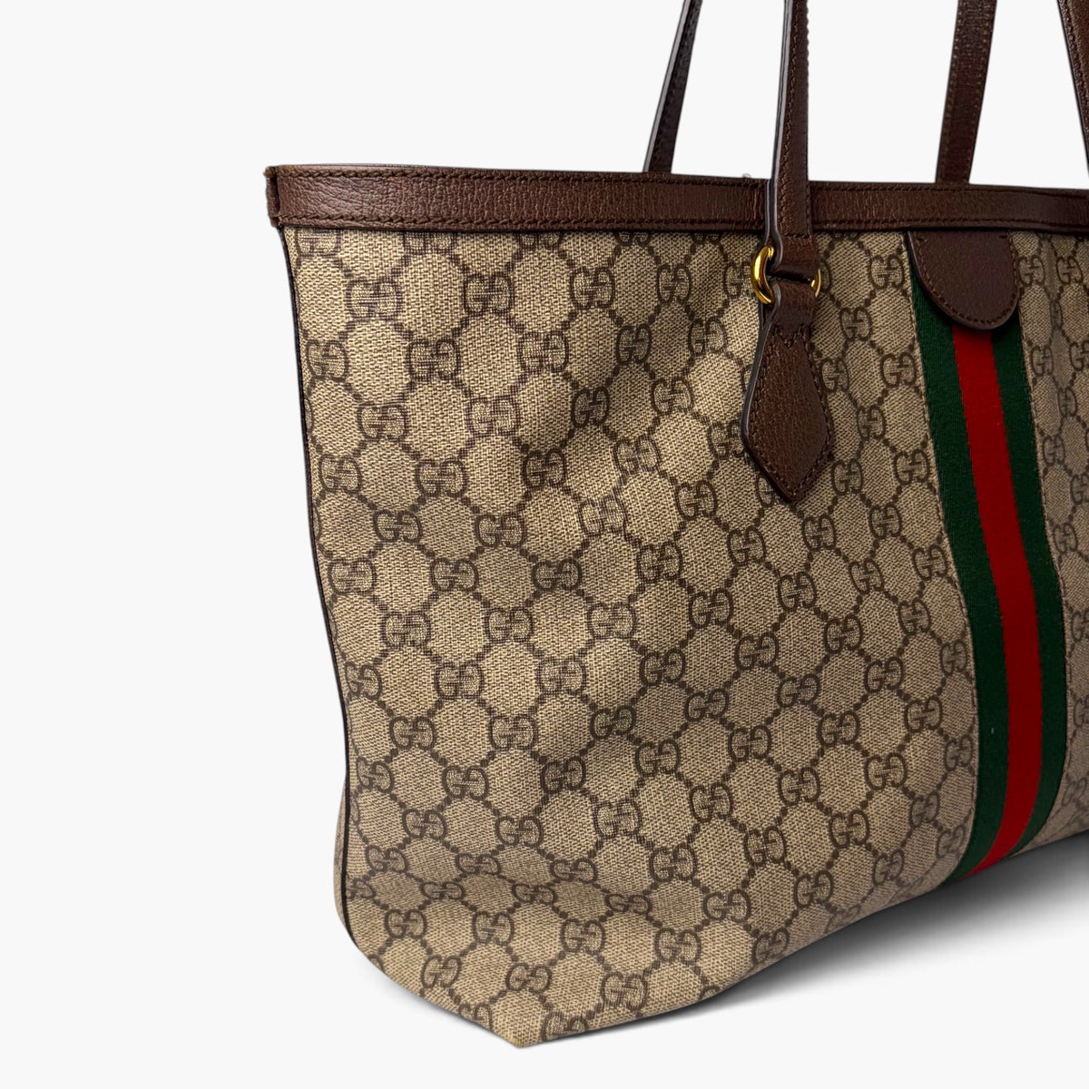 GG monogram medium tote side view with brown leather trim and red-green stripe