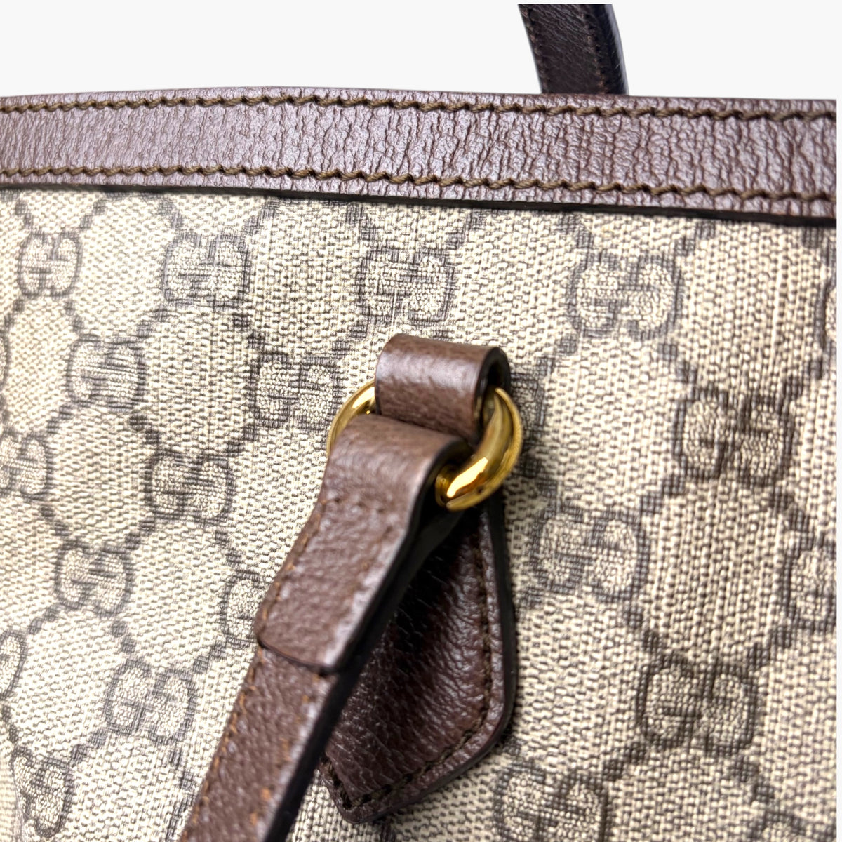 Beige GG monogram tote with dark brown leather tab and gold clasp hardware