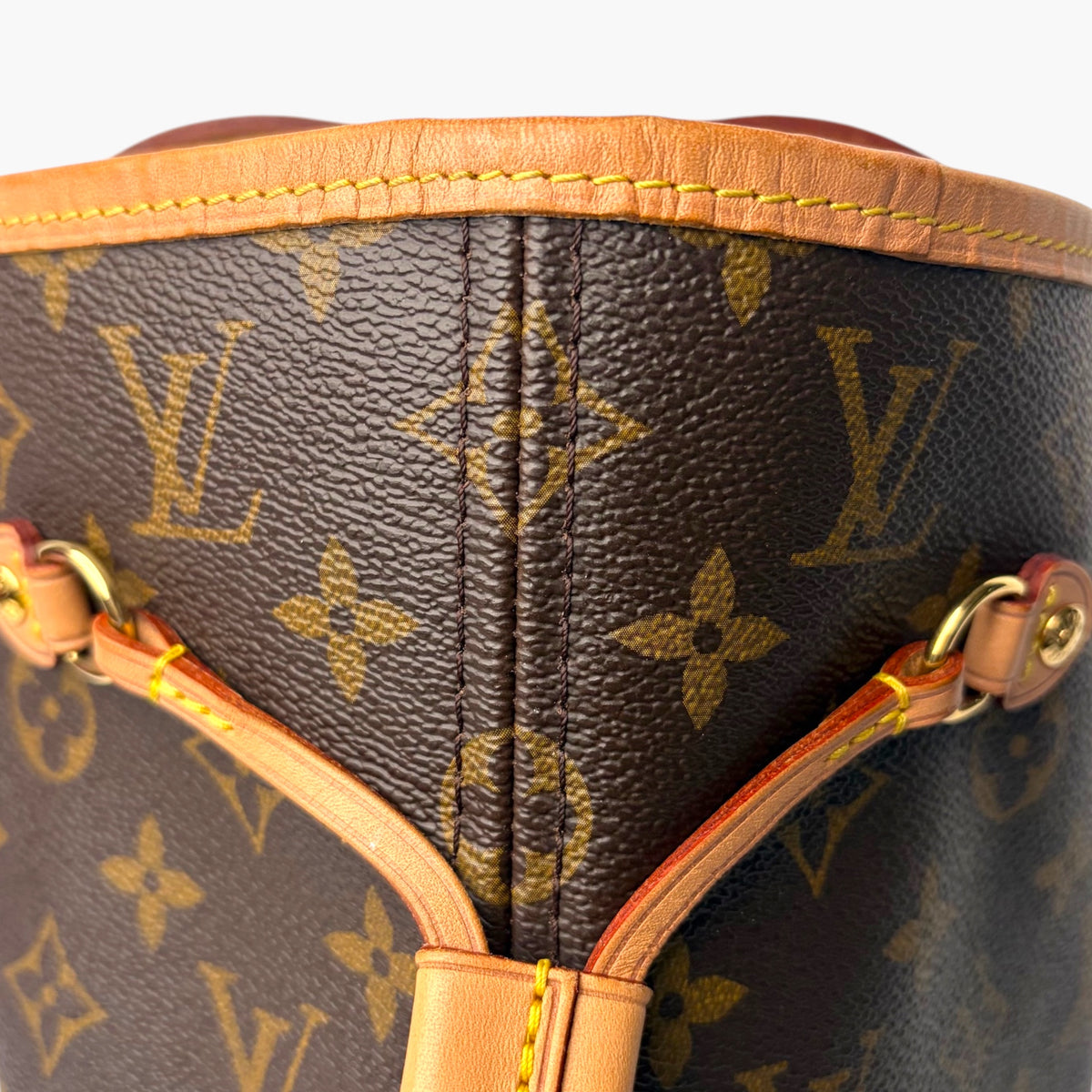 Monogram tote bag top with reinforced center seam and tan-trim drawstring cords