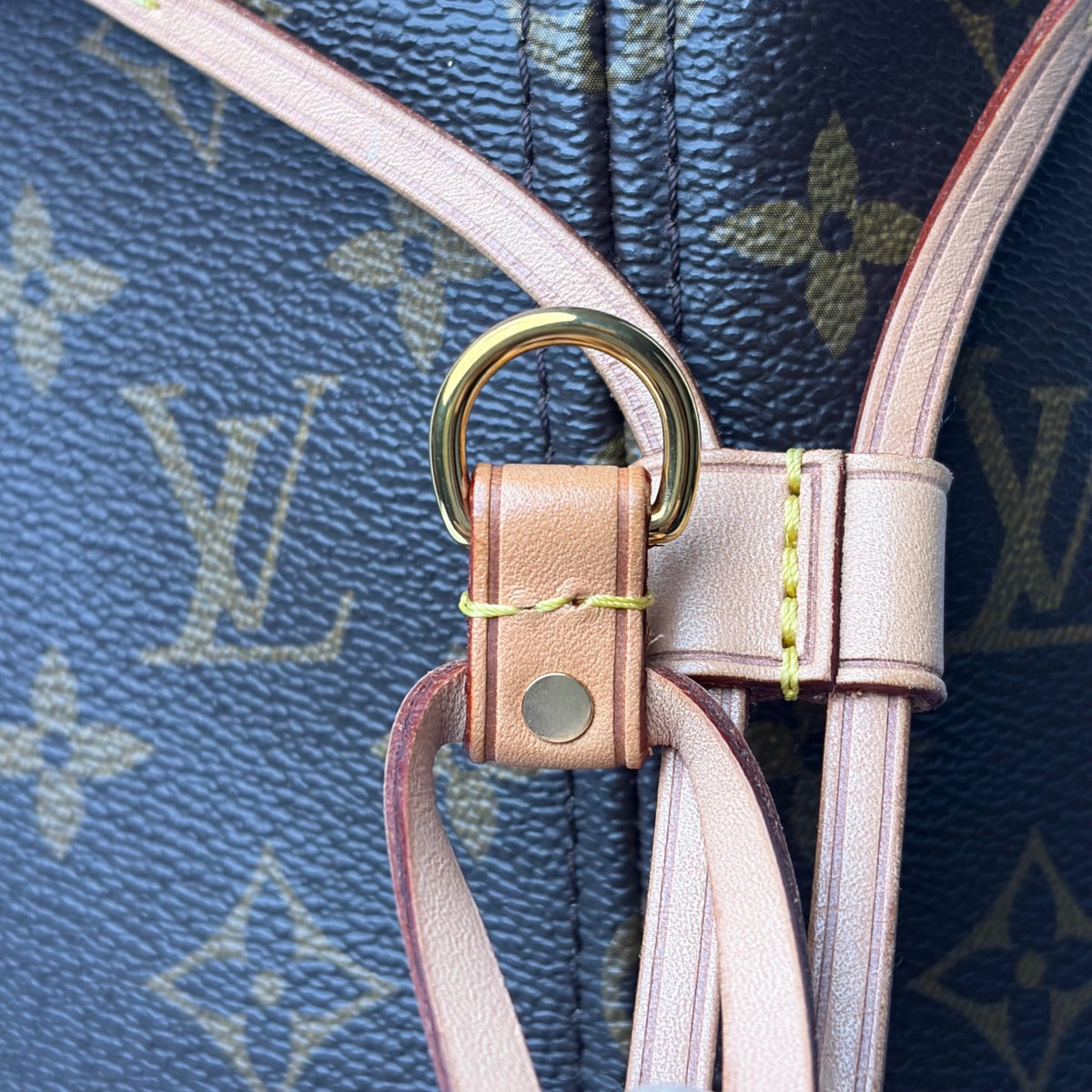 Blue monogram tote strap hardware with leather buckle and inner trim