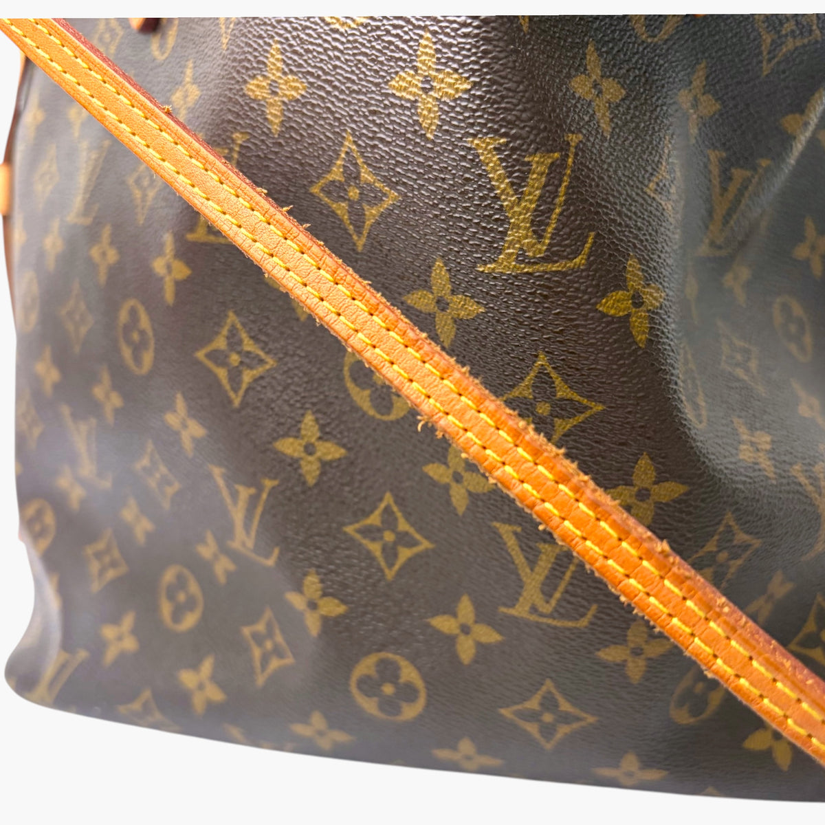Brown monogram tote bag with tan shoulder strap and contrast stitching