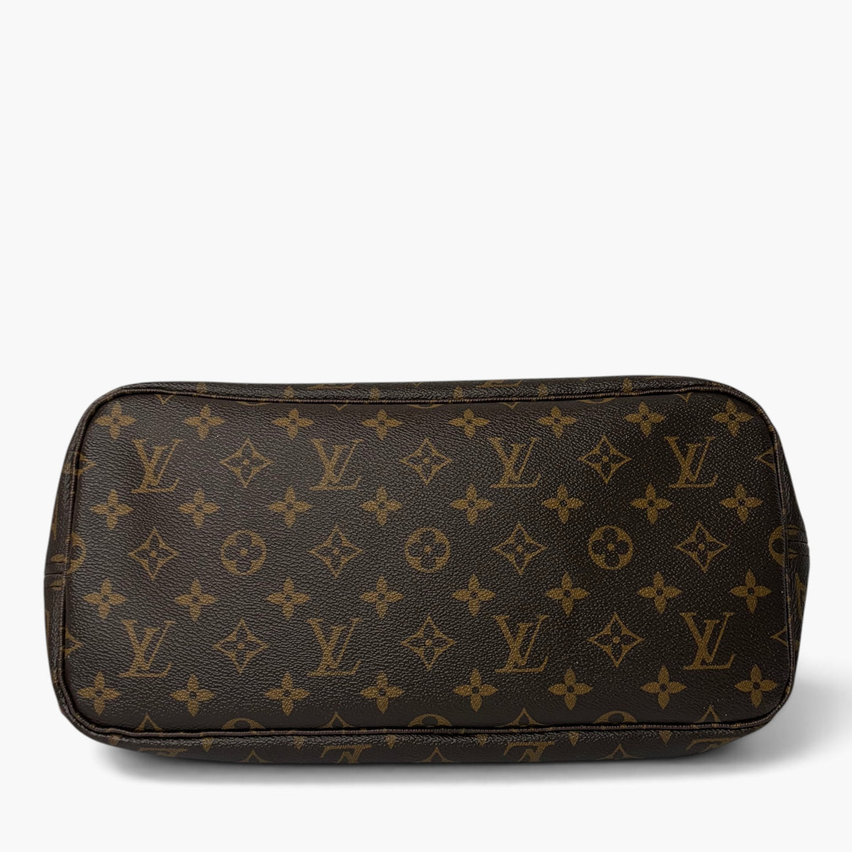 Brown monogram canvas pouch with gold-tone zipper and rounded rectangular shape