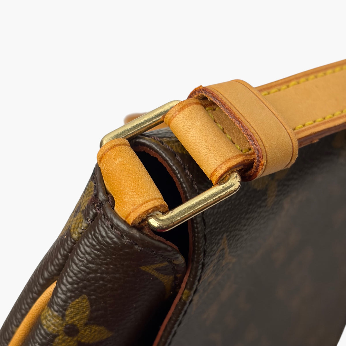Brown monogram bag with tan leather strap and metal ring attachment