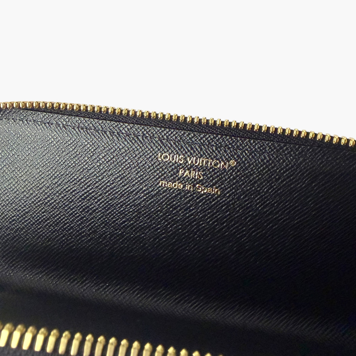 Dark blue pencil case lining with gold zipper edge and Louis Vuitton Paris stamp