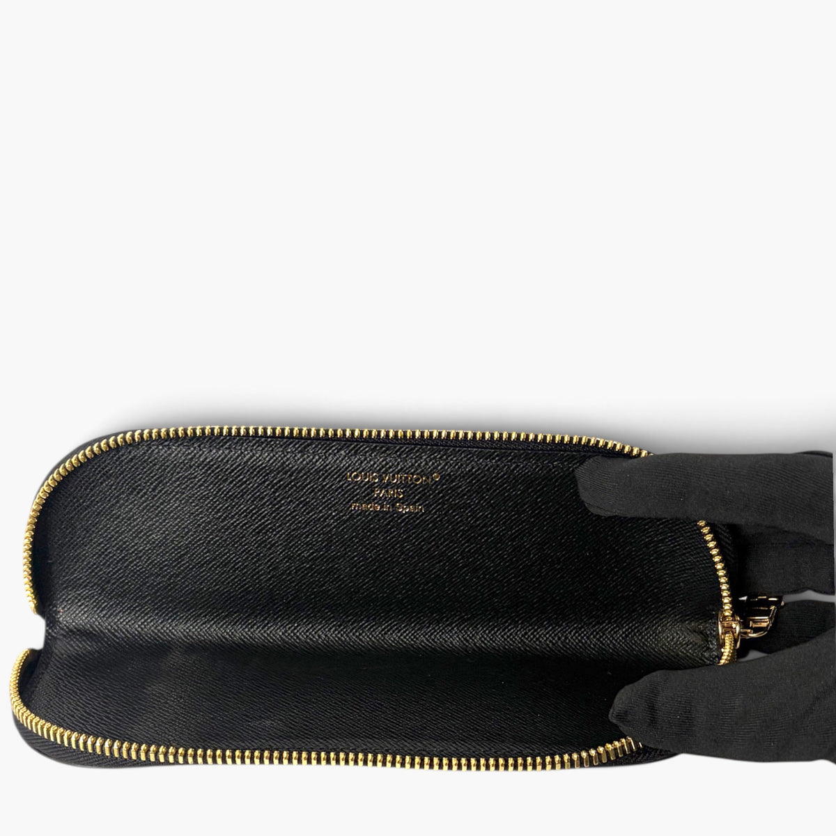 Dark blue zip pencil case with interior black lining, open top view