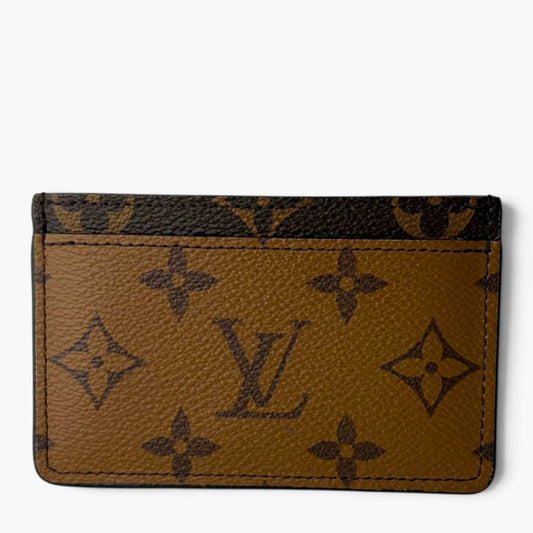 Brown monogram card holder with dark pattern and stitched card slots on front