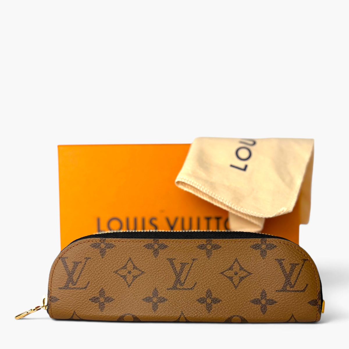 Brown Louis Vuitton monogram pencil case with gold zipper, shown with dust cloth and box