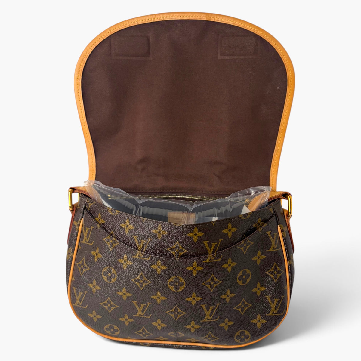Monogram canvas mini bag with tan leather trim and top snap closure