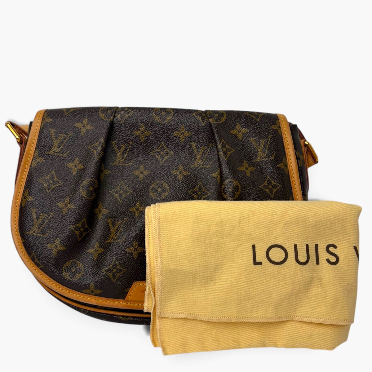 Monogram crossbody bag with tan trim and matching pouch labeled LOUIS