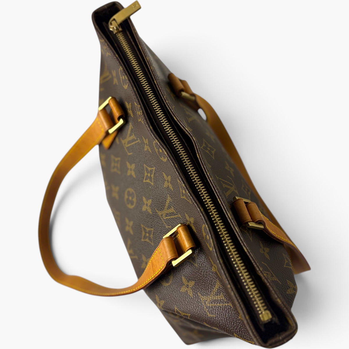 Cabas Piano monogram canvas tote bag side view with zip closure and leather strap