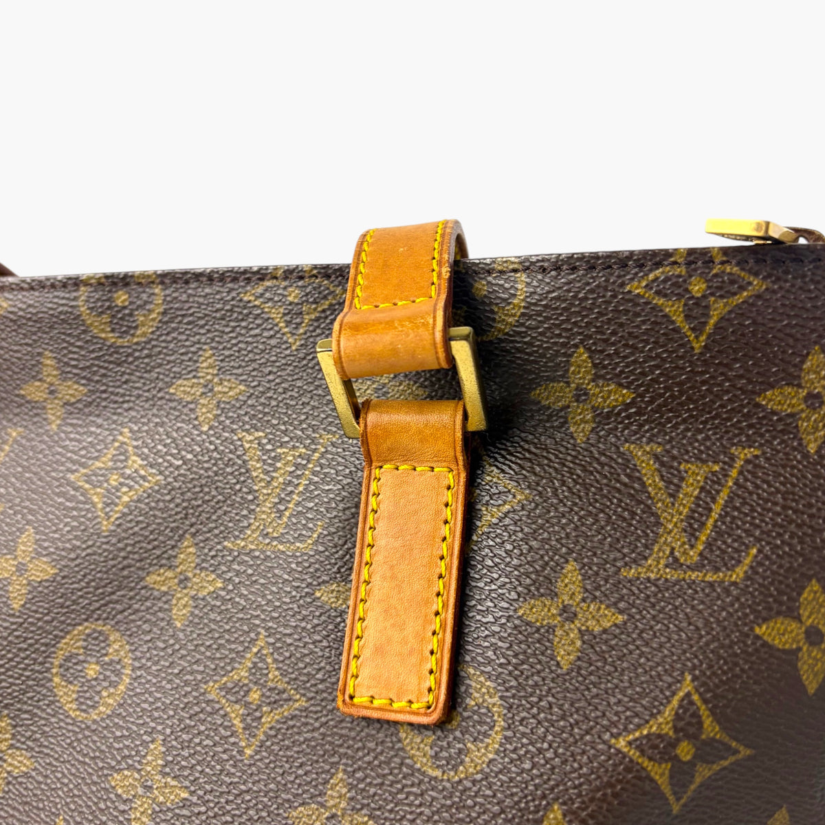 Monogram canvas tote strap with orange leather loop and stitch detailing