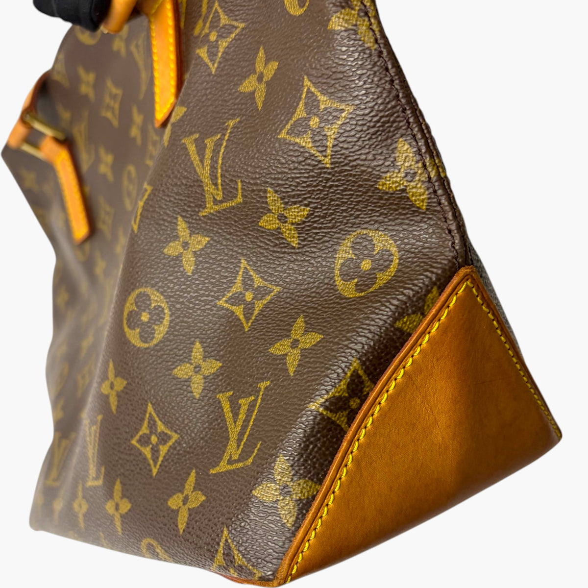 Brown monogram canvas handbag with bright tan leather side pocket and contrast trim