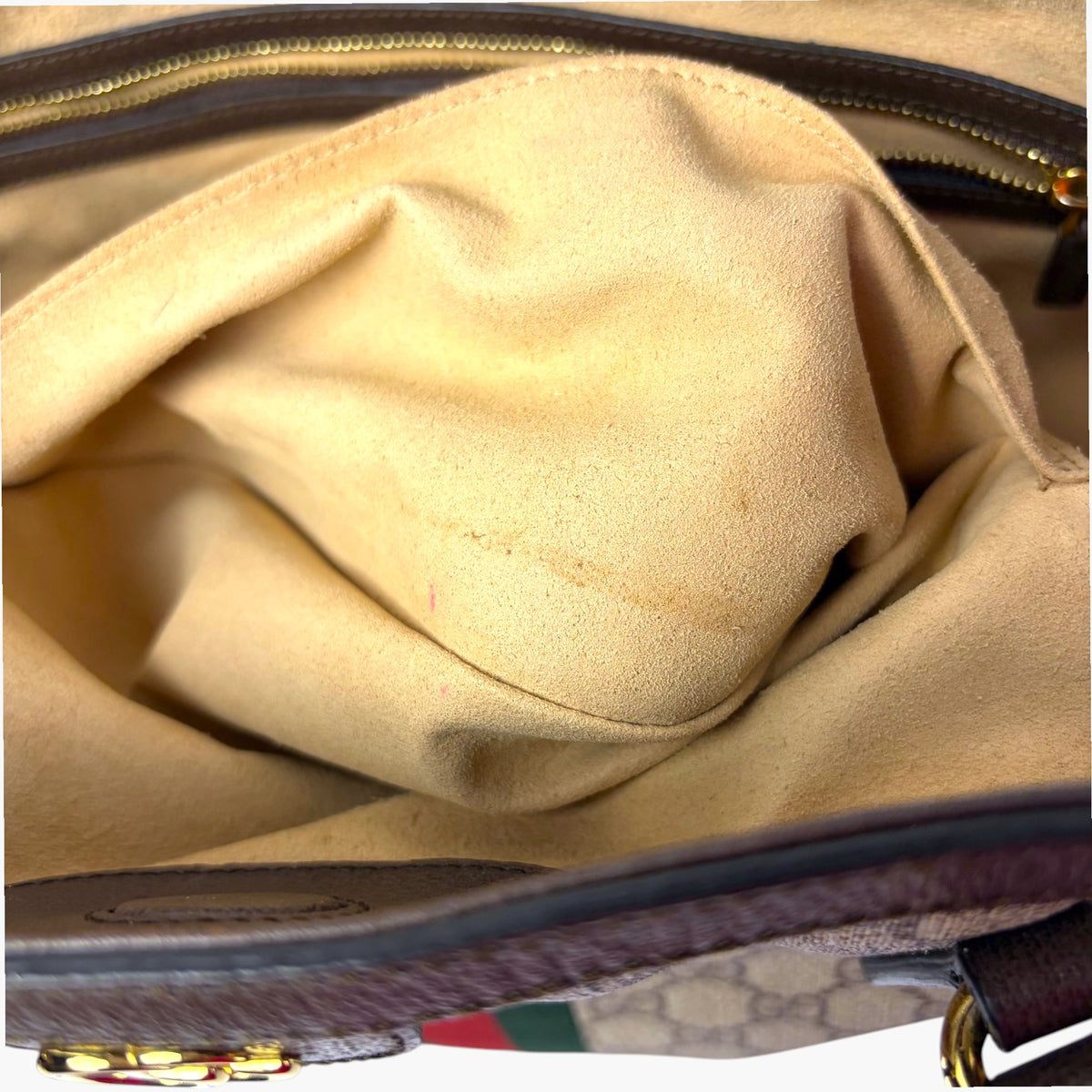 Tote interior lining view with zipper edge and brown leather trim