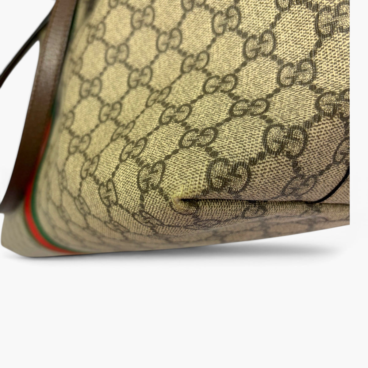 Beige GG Supreme canvas base with dark brown leather edge trim and pocket seam