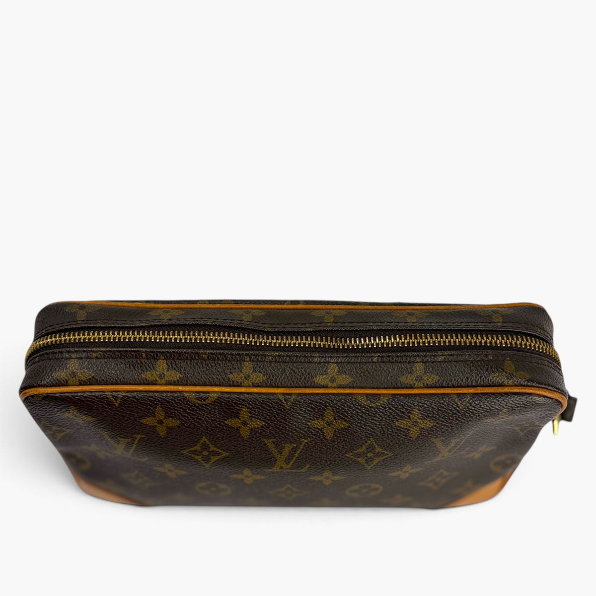 Monogram zip-top pouch with gold zipper and tan leather base trim