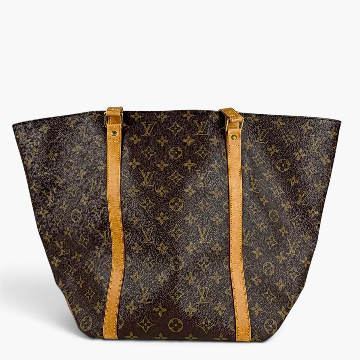 Monogram shopping tote bag with tan dual straps and gold-tone hardware