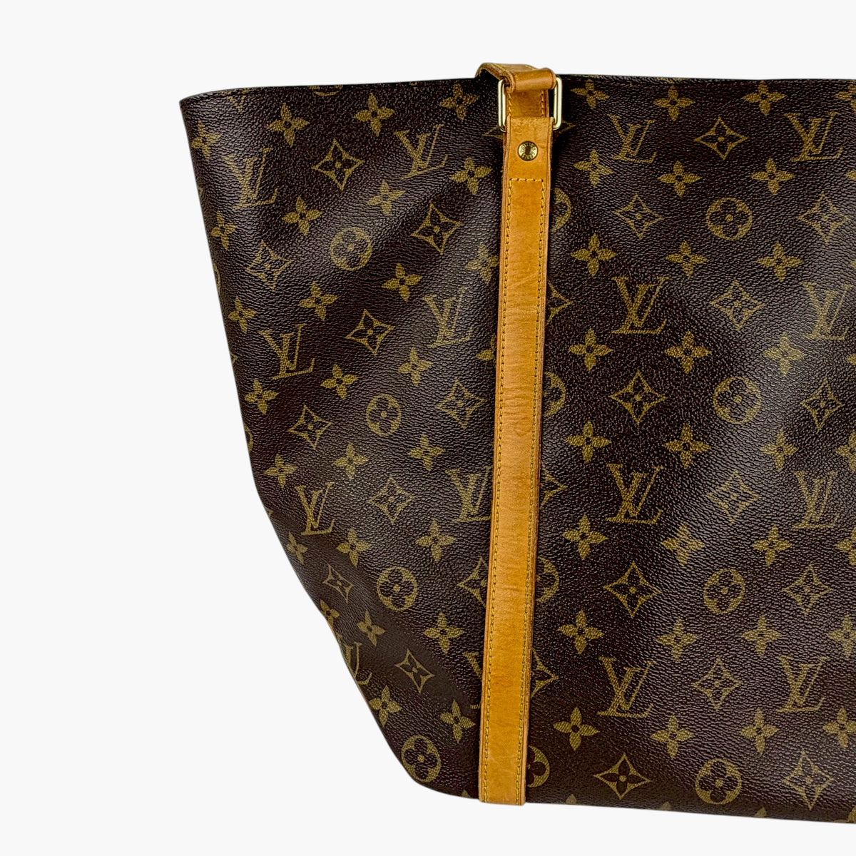 Brown monogram tote bag with tan center strap and gold-tone hardware