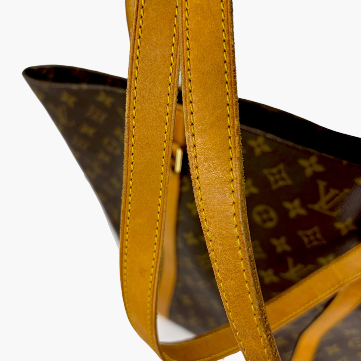 Brown monogram shopping tote with yellow leather-look handles and contrast stitching