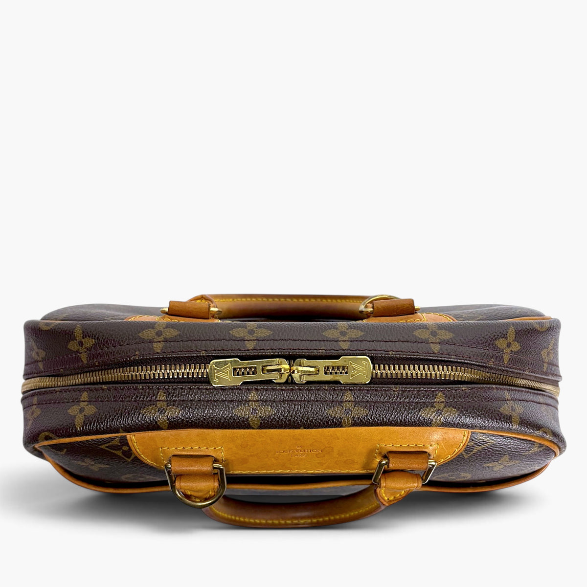 Brown monogram canvas mini bag with gold zipper and tan leather top handle