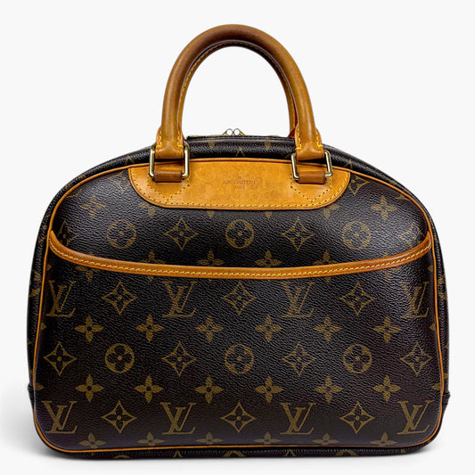 Brown monogram canvas dome handbag with tan leather top handles and gold zipper
